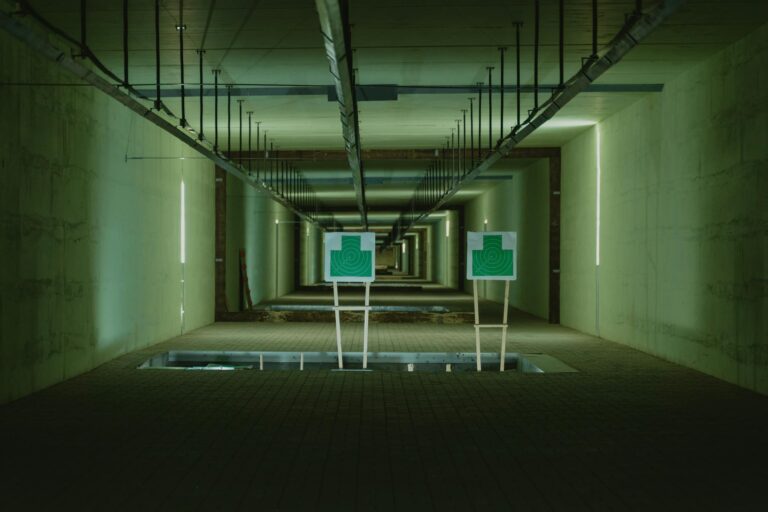 Perspective view of shooting range with two green targets indoors